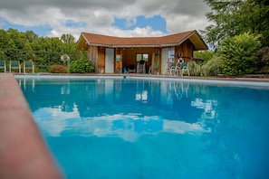 Pool shed with outdoor bathroom.