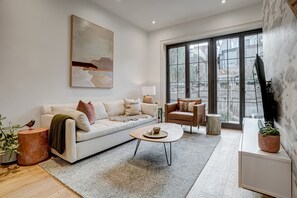 Comfortable living room with walkout to garden