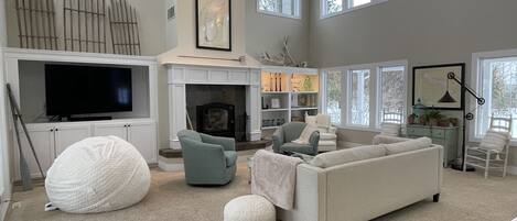 Living room with views out every window.