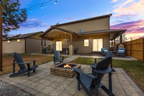 Embrace the outdoors in our beautifully landscaped backyard. Gather around the fire pit for cozy evenings, roast marshmallows, and share stories under the starry sky.