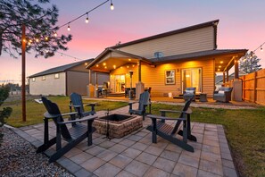 Embrace the outdoors in our beautifully landscaped backyard. Gather around the fire pit for cozy evenings, roast marshmallows, and share stories under the starry sky.