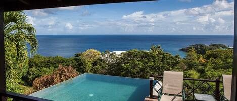 Dive into your gorgeous infinity pool and soak up the sunshine.