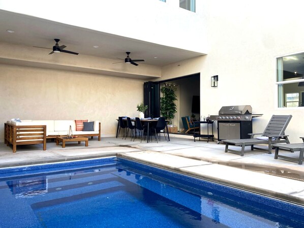 PATIO WITH SWIMMING POOL, GRILL, AND PLENTY OF SEATING FOR ALL!