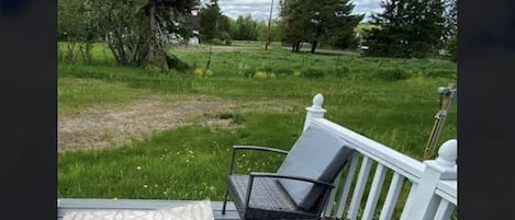 Back/side porch where you can sit and relax with the visiting deer and wildlife!