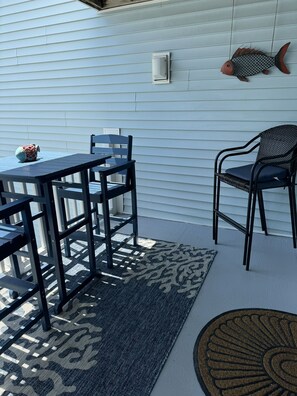 New  pretty table and chairs on freshly painted deck 