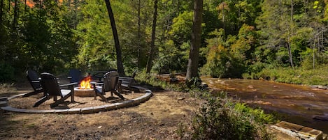 Enjoy the private fire pit and picnic table along the creek.