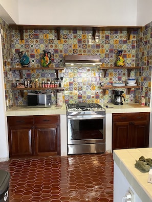 kitchen wall of hand made hand painted Mexican tiles