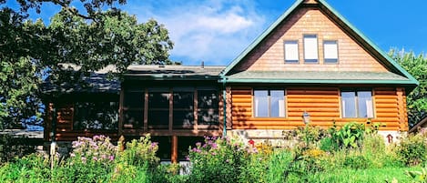 Perennial garden attracts birds and butterflies. Veggie garden for picking!