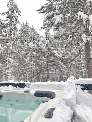 Large hot tub on Elevated Deck is perfect for watching the snow come down!