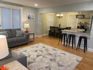 Large open plan family room flows seamlessly into kitchen and dining area