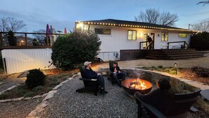 Custom backyard corn hole court and fire pit