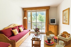 Sit back and relax in the living area. (Views vary).
