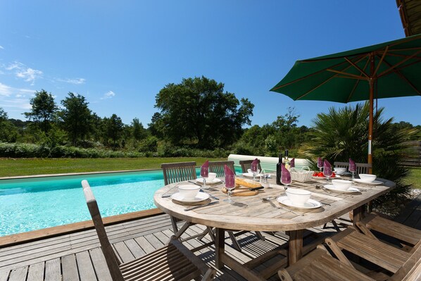Enjoy your meal by the pool.