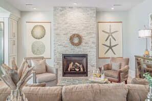 Cozy up and enjoy a glass of wine by the fireplace.