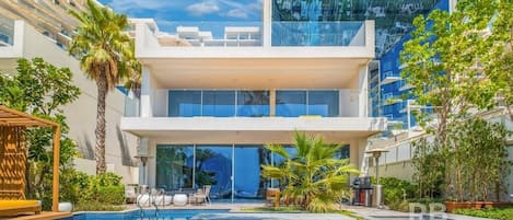 Stunning 13,000 square foot FIVE Palm Beach Villa spread across three floors, featuring elevator, large temperature controlled private pool to the rear / beach side garden, and a large jacuzzi on the top floor 