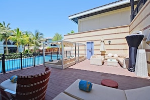 Beautiful large sun deck with sunbeds, cabanas, various seating, outdoor shower, patio heater, with direct lagoon pool access