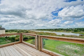 Experience coastal serenity just steps from your townhouse, with a picturesque outdoor panorama that enhances your seaside retreat.