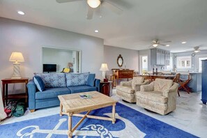 Indulge in relaxation in the snug living room, your ideal escape following a day of beach adventures.