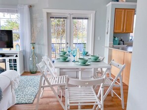 The dining table is usually tucked away but can be opened up for meals