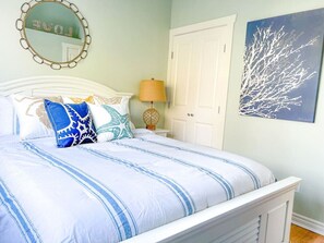 The queen bedroom is at the back of the house with views of the canal