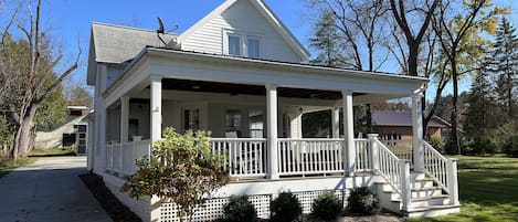 Updated home with spacious wraparound porch and free on-site parking