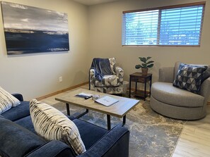Enjoy this comfortable seating area with a sofa bed and google TV.