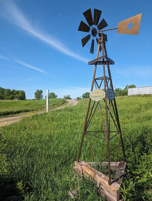 Look for this windmill next to the road and driveway.
