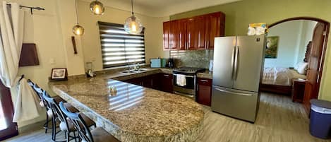 Fully equipped kitchen with new appliances.
