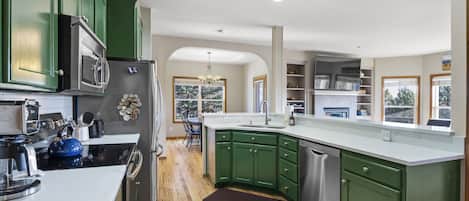 Prep meals effortlessly in this spacious kitchen located near dining area.