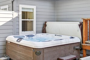 Unwind after a day of adventure in own hot tub, comfortably accommodating 4 to 6