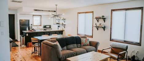 Living area adjusted to the open kitchen and dining area.