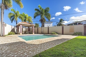 Escape to a private garden paradise with a shimmering pool