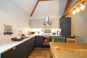Nadin Cottage open plan living area with newly installed kitchen with integrated appliances