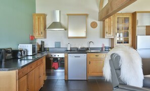 Open plan living area kitchen with underfloor heating