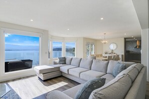 Where comfort meets style! Relax in the spacious living room with cozy seating, elegant decor, and stunning views perfect for unwinding after a day of adventure.