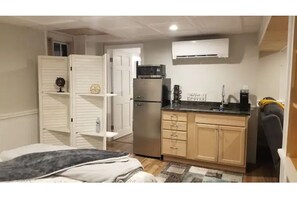 Kitchenette with fridge, sink, keurig, and toaster