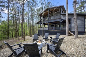 Back of cabin with second story balcony