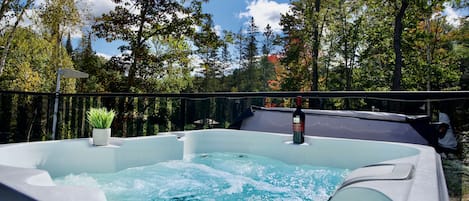 Enjoy the 4-person hot tub, where you can unwind and soak your stresses away.