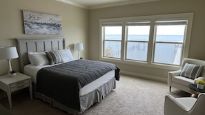 Master bedroom 1 (queen bed) on the 2nd floor with a waterfront view