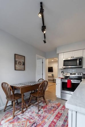 Kitchen table with folding wings and a view into the living room area