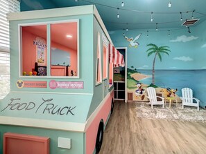 A themed playroom with food truck and toys for hours of playtime.