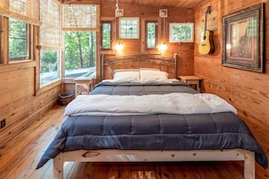 "Walk-through room" with king bed and so many windows, upstairs