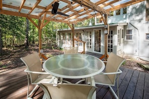 Private, covered back deck off middle futon room, for relaxing or meals