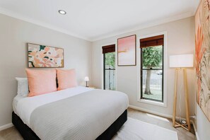 The third bedroom includes a queen-size bed, with split system air-conditioning and heating keeping guests comfortable year-round
