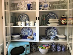 The owner collects blue and white dishes and is happy to share with you