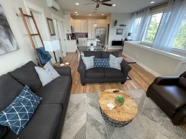 Seating area for six including leather recliner, loveseat and sofa