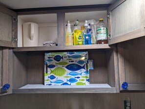 Cleaning products over the sink for safter when children visit.
