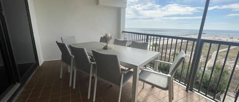 Large Gulf front balcony with dining for 8 and view of Perdido Pass 