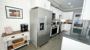 Large kitchen with a stocked coffee bar