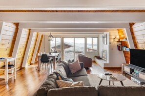 A-frame interior with wood detailing.